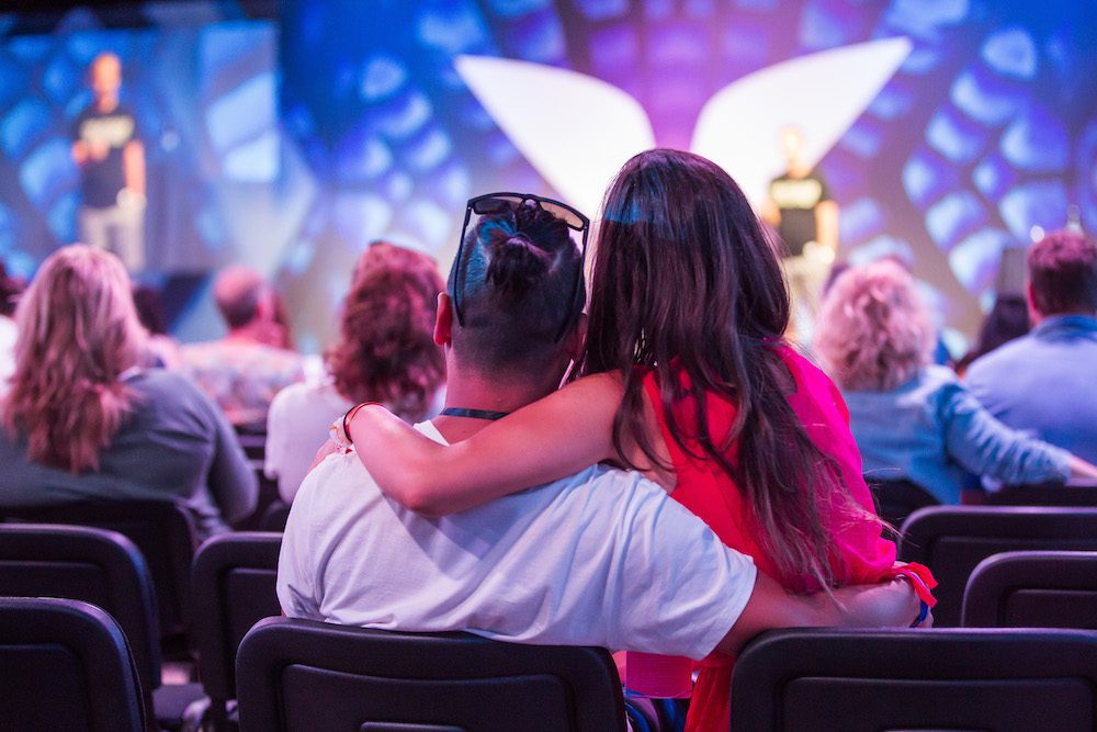Couple hugging at Mindvalley's A-Fest 2018 in Sardinia