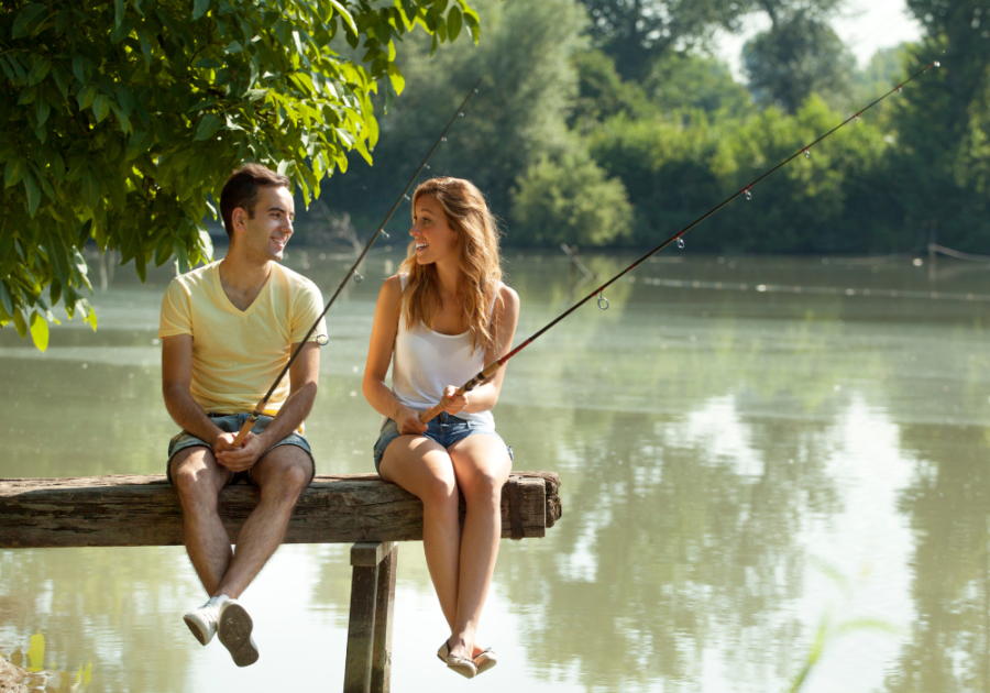 young couple having a fishing date how to tell if a guy is a virgin
