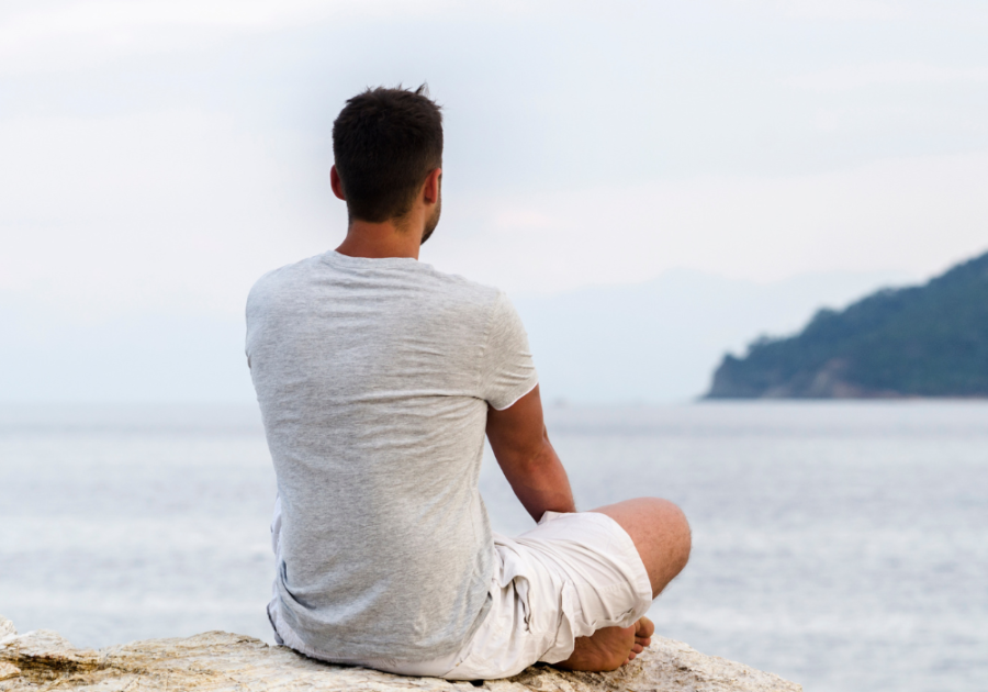 man watching the calm sea priorities in life