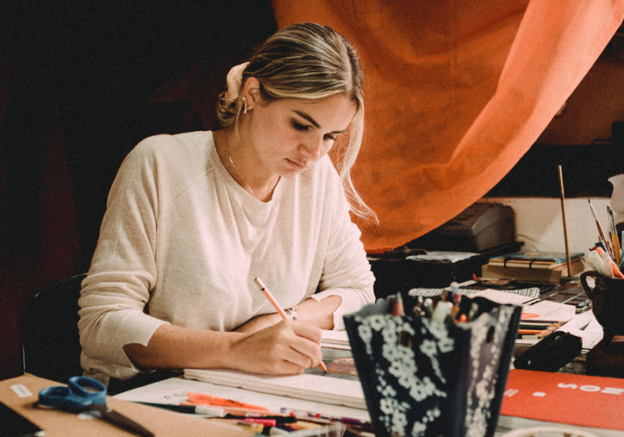 woman in her 30s painting as a hobby hobbies for women in their 30s