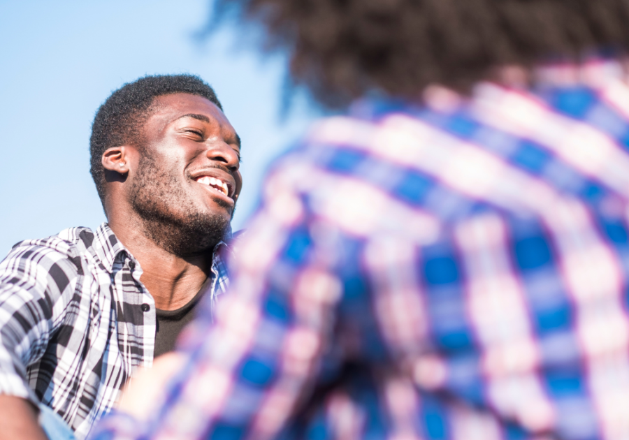 man laughing how to be more witty 
