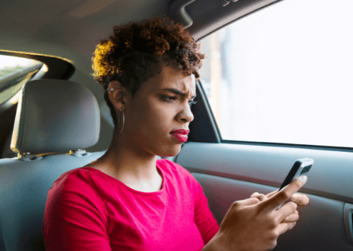 woman sitting in back of car how to respond to a narcissist text