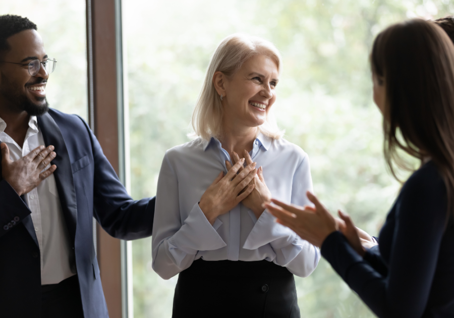 woman in corporate clothes smiling how to respond to a compliment