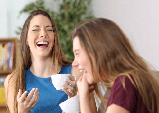 women drinking coffee and laughing weird things to say